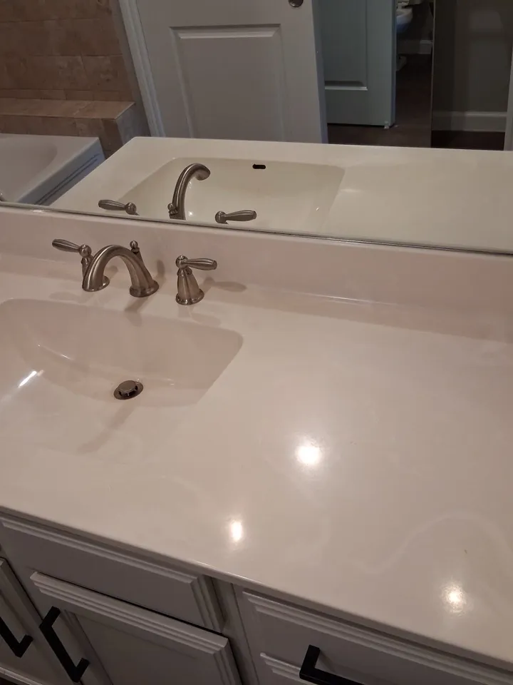 The same bathroom vanity cleared, wiped and polished
