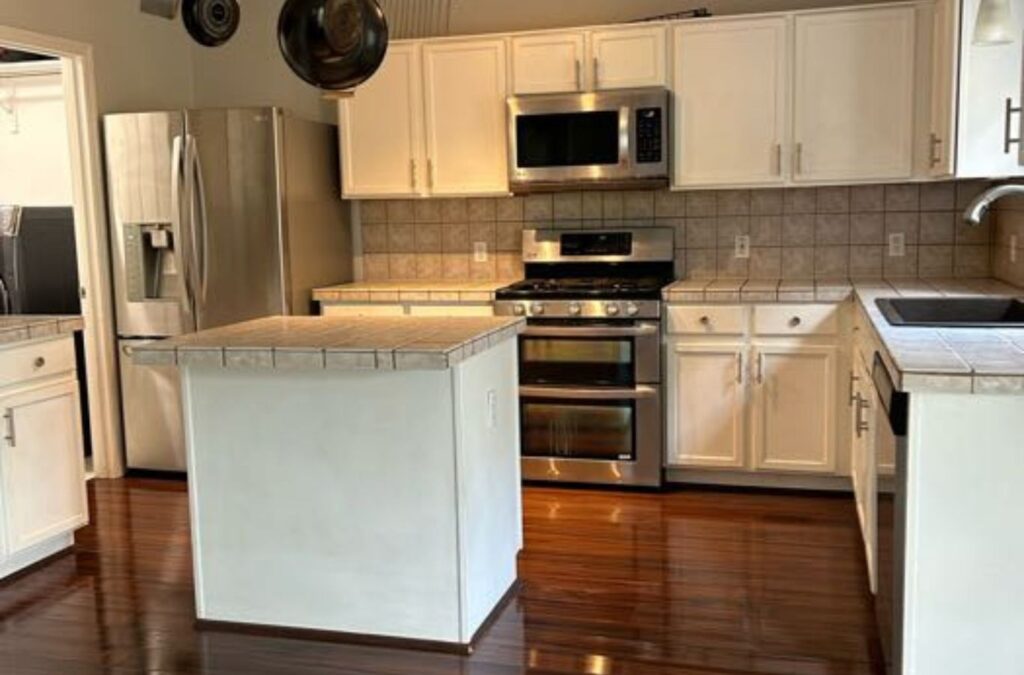 A Swept Up Cleaning Co employee providing expert cleaning services in Grand Prairie, TX, using eco-safe tools to deliver pristine spaces with care.