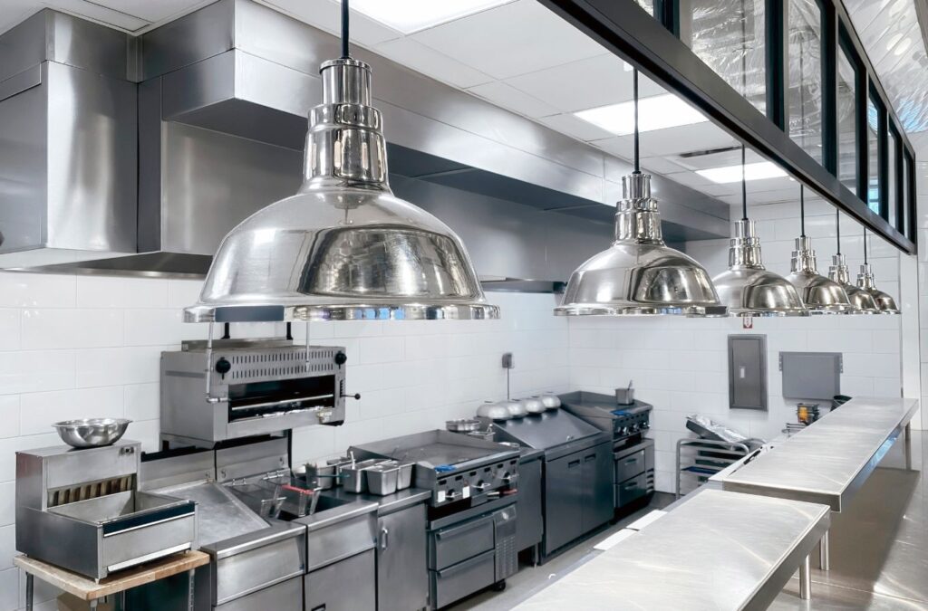 A Swept Up Cleaning Co team member making a kitchen shine in Irving, TX, highlighting the benefits of professional kitchen cleaning services.